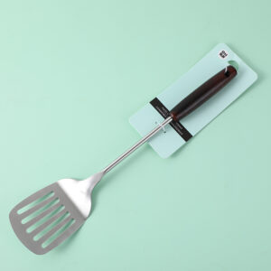 Slotted turner with wooden handle - Image 1